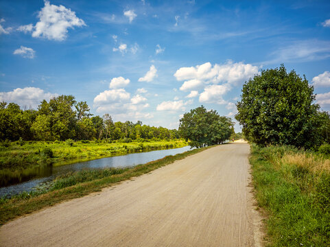 Gravel road along the Żeranski Canal - a 17.3 km long water canal connecting the Vistula River and Zegrzyńskie Lake, Poland