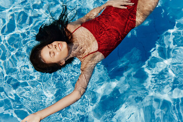 Woman female blue water swim summer pool - Powered by Adobe