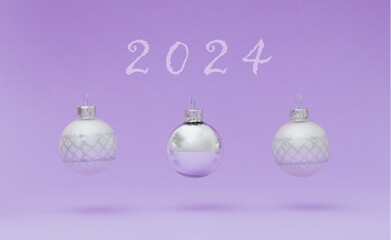 Creative composition made of Christmas baubles jumping on pastel violet background. Minimal Christmas or New Year concept. Trendy winter holidays idea. Fancy New Year 2024 layout. Christmas aesthetic.