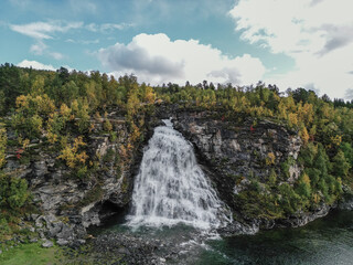 Aerial view of Rovijokkfossen waterfall in Skibotndalen, Norway. Autumn season.