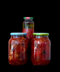 cans of preserved lecho and tomato juice