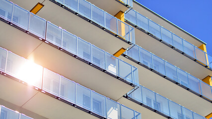  Modern luxury residential building. Modern apartment building on a sunny day. Facade apartment building  with a blue sky. 