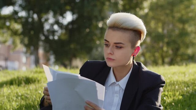 Video of young satisfied expert looking for new job successful career business worker blonde girl check cv. Beautiful woman formal suit agreements.
