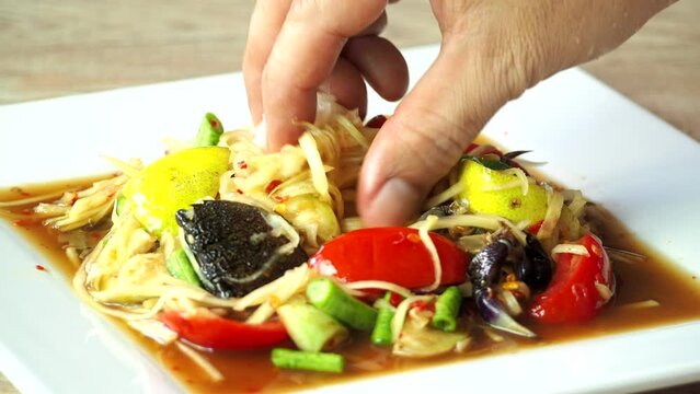 Thai papaya salad or Somtum, in door Chiangmai Thailand.