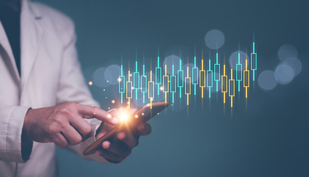 Businessman trader investor analyst using smartphone analytics for financial market analysis, Online stock trading and algorithmic concept with digital financial candlestick, Invest in trading.