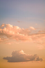 Soft Pink Clouds Dancing Across the Azure Sky at Dusk