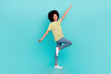Fototapeta na wymiar Full length photo of overjoyed crazy girl wear stylish clothes hands wings fly air summer holidy weekend isolated on cyan color background