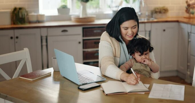 Working mother, laptop and writing with baby at table with smile in home for remote work deadline or multitask worker. Mom, child and life balance with notebook, productivity and business owner