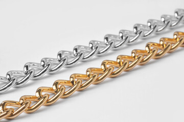 Metal chains isolated on white, closeup. Luxury jewelry