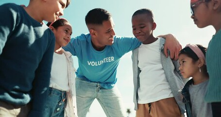 Volunteer coach, diversity and teamwork on field for charity event with happiness and collaboration. Children, man and motivation with together for community service, sustainability or sport trainer - Powered by Adobe