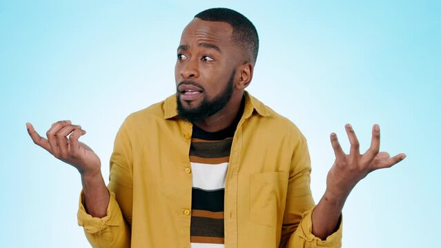 Portrait of black man, confused and hands out with doubt, questions and asking why on blue background. Confusion, shock and person thinking no with frustrated gesture, decision or opinion in studio.