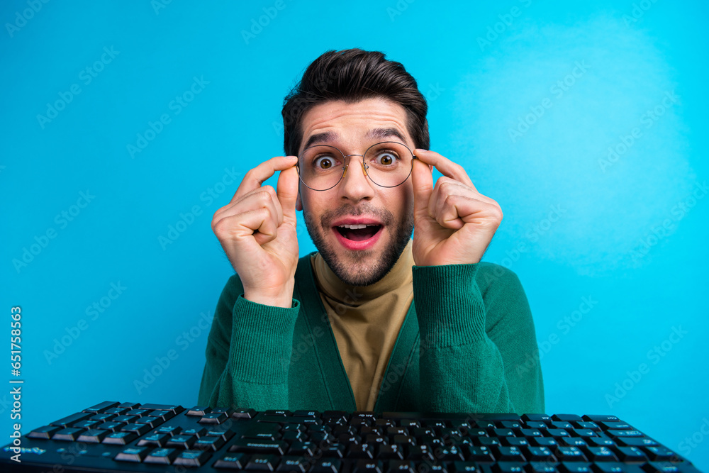 Aufkleber Closeup photo of excited young man programmer near mechanical keyboard digital technology geek surprised isolated on blue color background