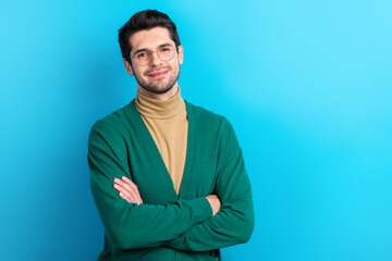 Photo of positive corporate lawyer folded hands posing empty space ad information isolated on blue color background