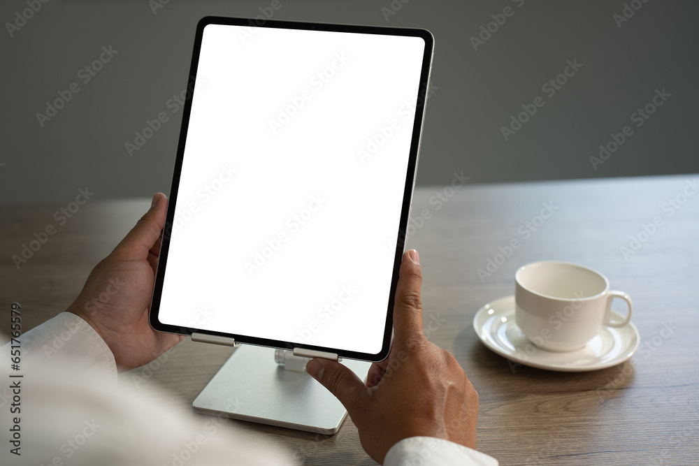 Poster digital tablet computer close up man using tablet hands man multitasking with isolated screen