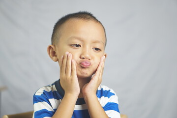 A boy has a toothache from gingivitis