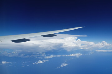 A plane fly in the sky.