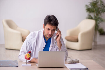 Young male doctor in telemedicine concept