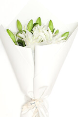 White lilies on a old wooden background. lilies on a white background.
