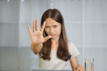 Asian woman working at home Scold the employee for making a mistake. Don't make that mistake again.