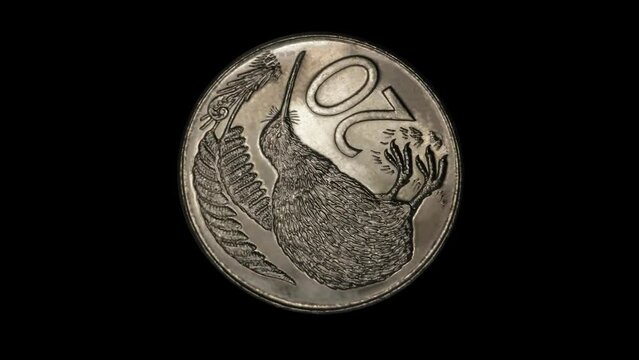 Reverse of New Zealand coin 20 cents with image of a kiwi bird isolated in black background. 3d animation in 4k resolution video.