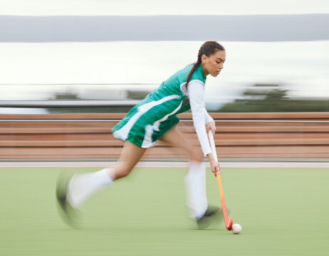 Hockey, sports or woman running in game, tournament or competition with ball, stick or action on turf. Blur, training or fast girl player in exercise, workout or motion on artificial grass for speed