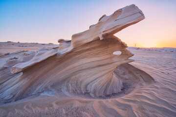 Desert eroded rock pattern with clear sky during the sunset. Desert rock formation with erosion
