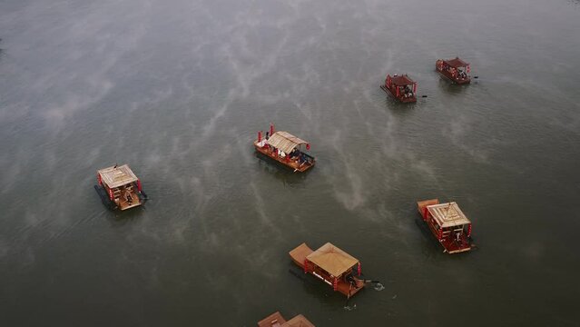 Asian chinese boat with mist on a lake in Thailand. Aerial shot 