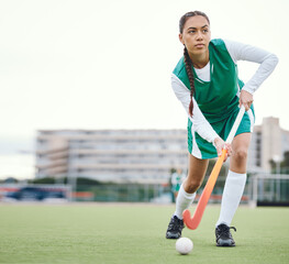 Field, hockey and woman running in game, tournament or competition with ball, stick and action on...