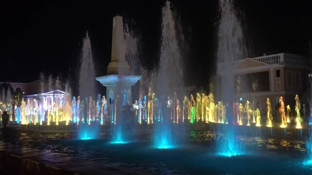Colorful beautiful dancing fountain and laser show. Vigan city, Ilocos Sur, Philippines. Travel vacation concept.