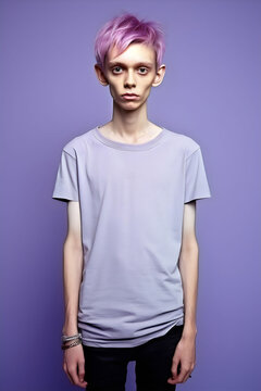very skinny boy with purple hair and tshirt, isolated on plain studio background