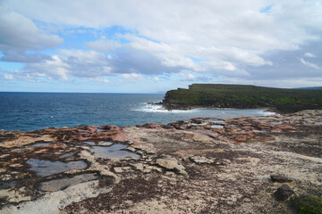 Landscape nature of cliff with ocean at Royal national park coastal walk in Sydney NSW Australia - Nature travel track from Wattamolla. Travel outdoor and Picnic Activity 