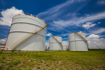 Tank farm in industry Thailand with white oil and petrol silos