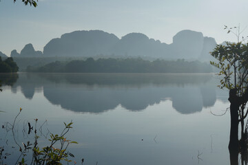 Landscape Nature View of Nong Thale Lake in Krabi Thailand -beautiful limestone mountain with reflection on the lake Morning view. Unseen In Krabi 