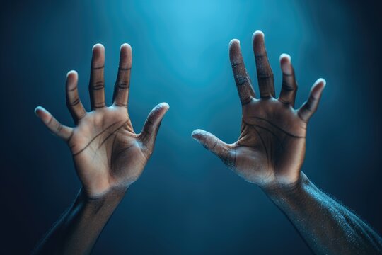 Two hands on a blue background