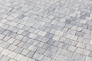 Stone pavement on the sidewalk as an abstract background. Texture