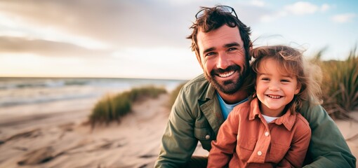 a young girl and an his father are laughing in a beach - obrazy, fototapety, plakaty