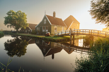 Traditional Houses Reflecting The Canal