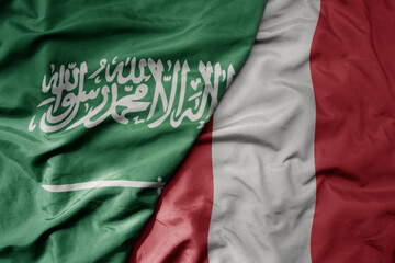 big waving realistic national colorful flag of saudi arabia and national flag of peru .