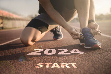 happy new year 2024,2024 symbolises the start into the new year.Start of people running on...