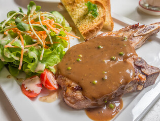 pepper steak made from pork and side dishes