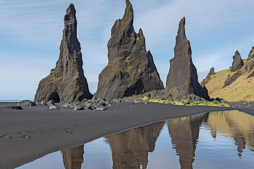 A serene beach on Iceland's northern coast, with its tranquil waters reflecting the surrounding mountains and colorful skies, an idyllic destination that invites visitors to immerse themselves in the