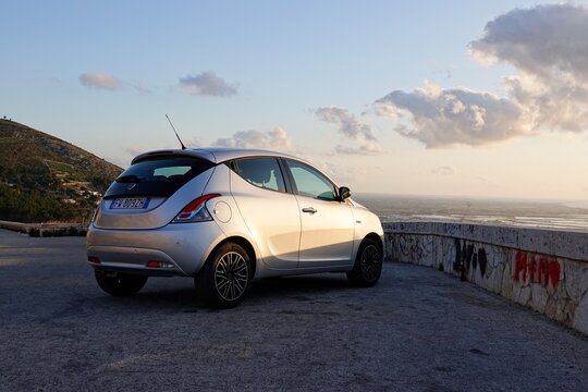 Lancia Ypsilon 3rd generation mini hatchback at sunset near Erice, Sicily