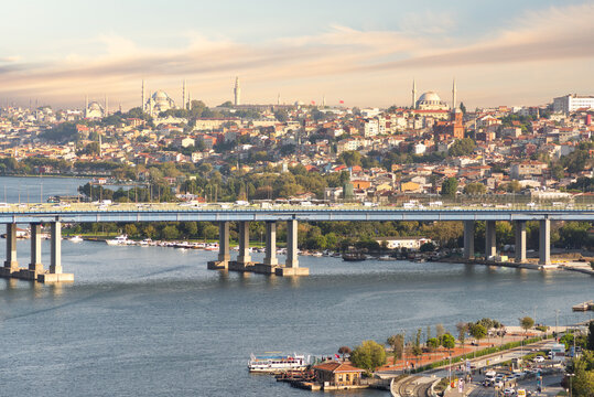 Aerial view from Pierre Loti popular hilltop park of the Halic Bridge, spanning the Golden Horn in Istanbul, Turkey, with background of city skyline, with historic mosques towering above the city