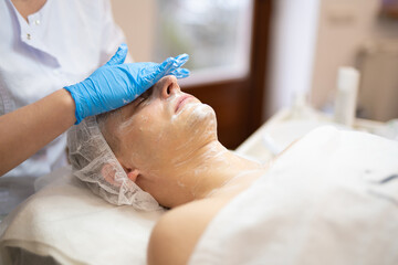 cosmetic procedures on a man's face in a beauty salon