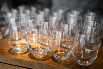 empty clean glass glasses for alcoholic drinks in a restaurant on a bar counter
