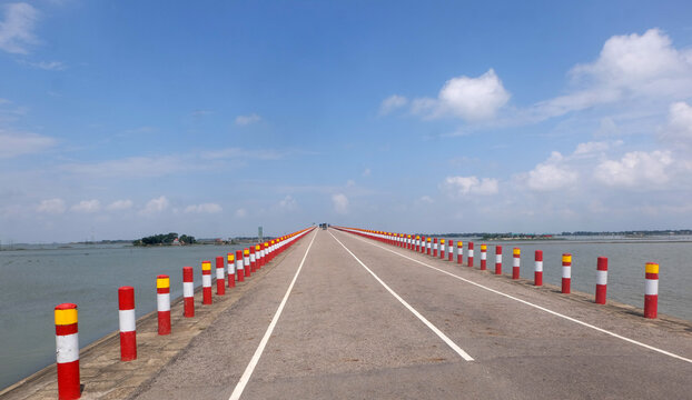 Nikli Kishoreganj is a mind-blowing road passing between water and sky on both sides. Natural view of nikli and austagram which attracts tourists in kishoregonj,Bangladesh.