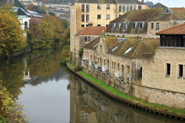Fototapeta na wymiar Houses in Bath, UK, with balconies overlooking the River Avon.