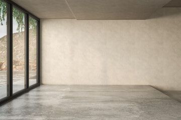 Empty room with beige wall and concrete floor.