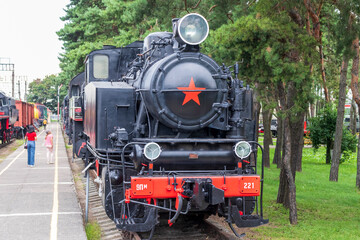 Brest, Belarus - 08.25.2023 - Visitors at the railway museum. Outdoors - obrazy, fototapety, plakaty