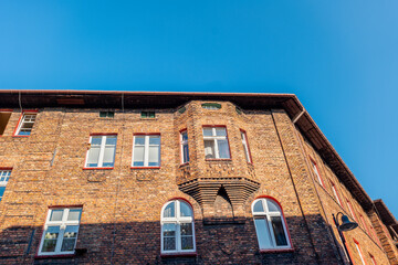 Traditional, silesian district Nikiszowiec. Renovated, old, brick block houses, build for coal miners in 1908-1919.Beautiful, afternoon light. .